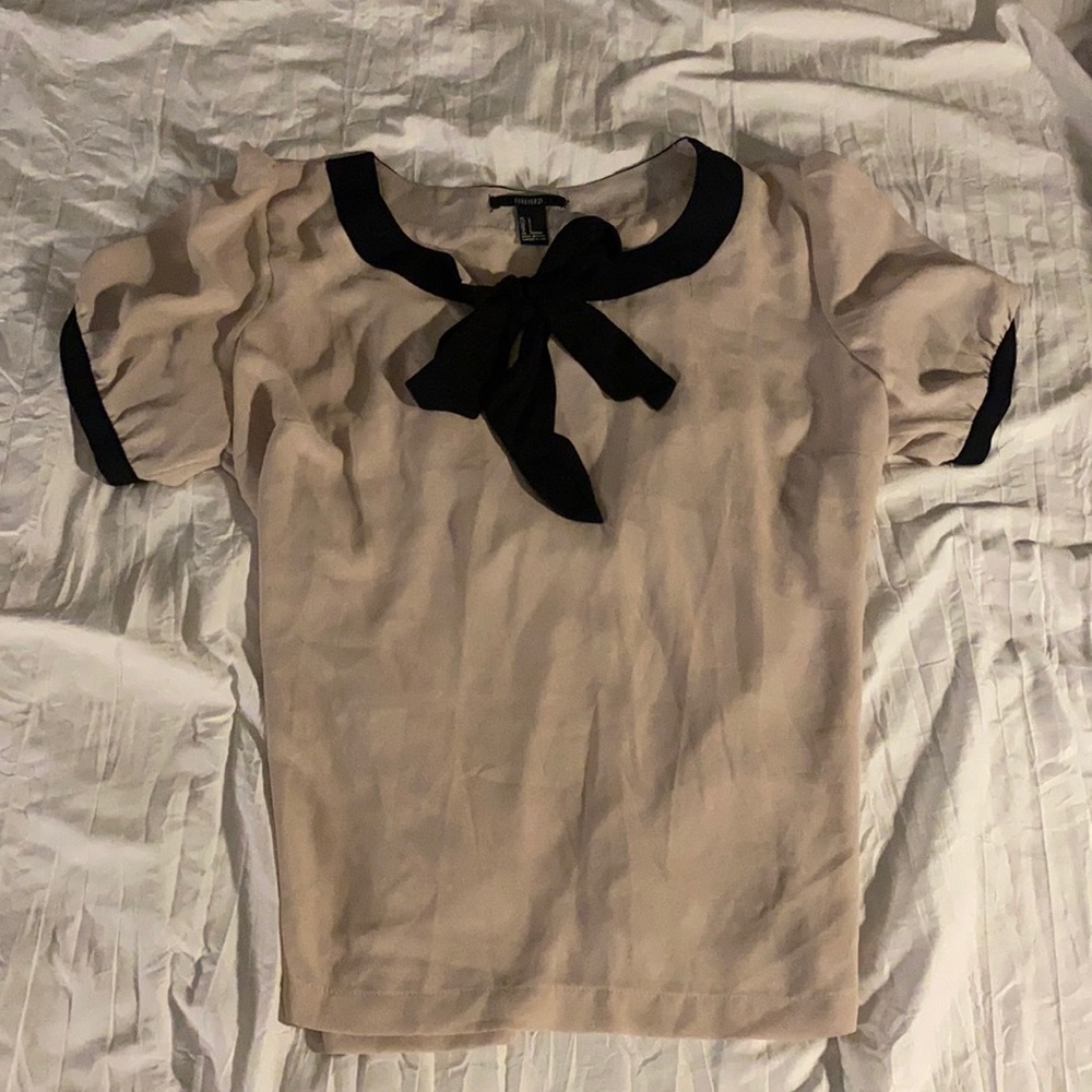 Cream blouse with black bow